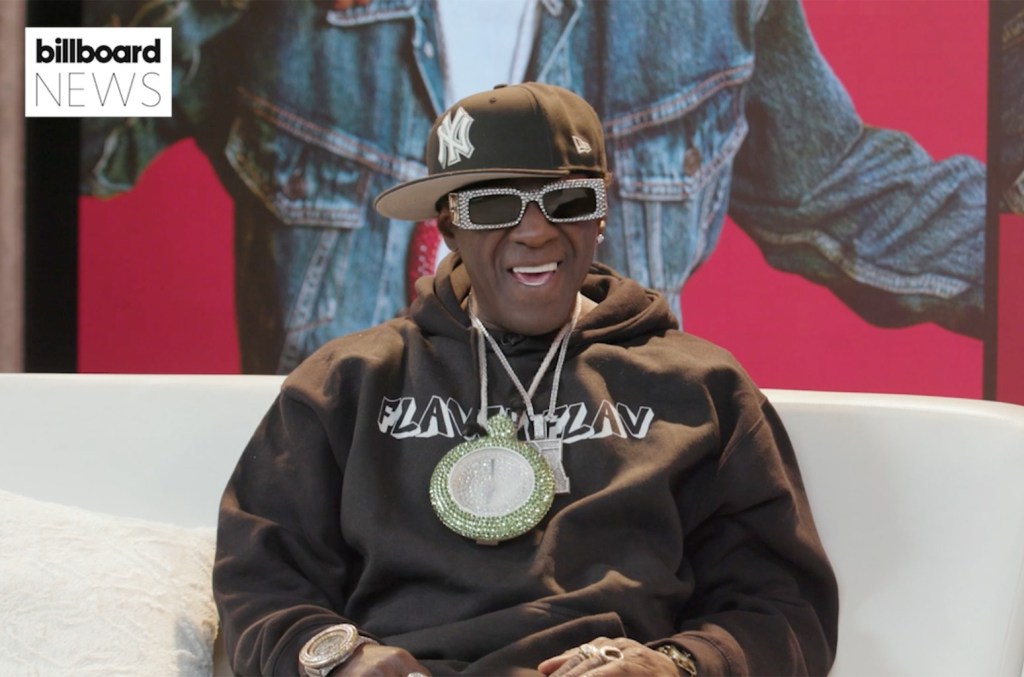 Flavor Flav Shows Off His Taylor Swift Hoodie, Talks Ai