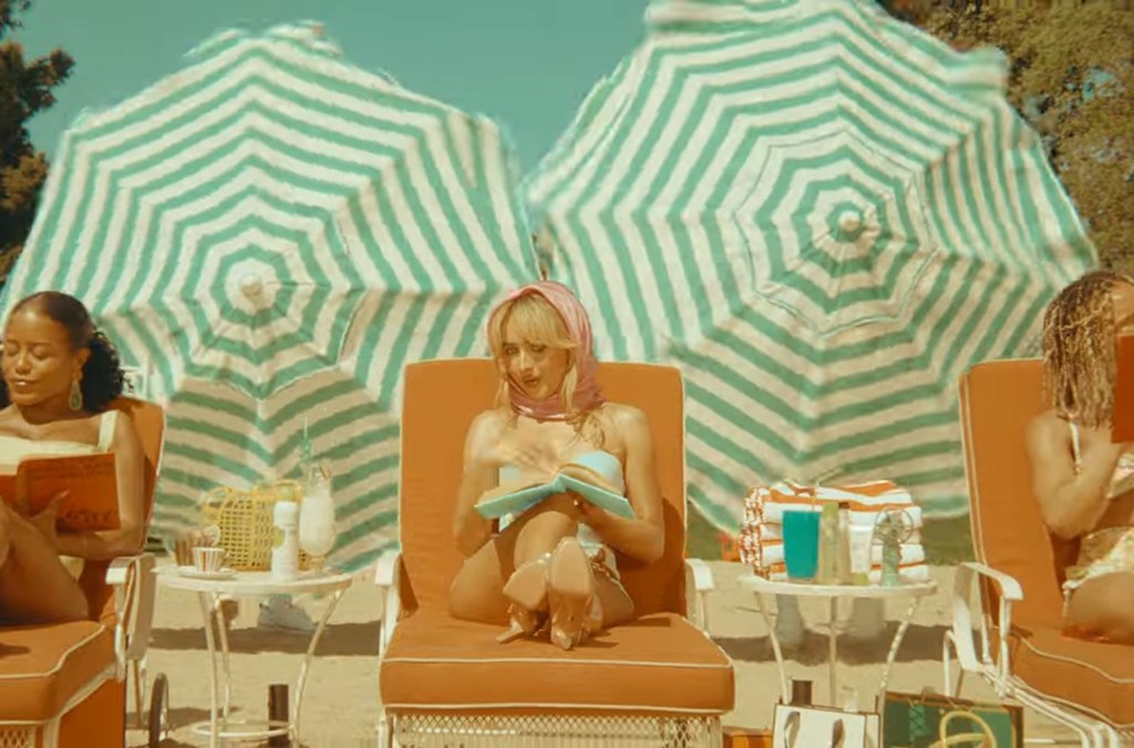 Sabrina Carpenter Lounges Beachside In Retro 'espresso' Music Video.