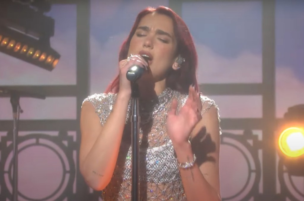 Dua Lipa Performs 'radical Optimism' While Pulling Double Duty As
