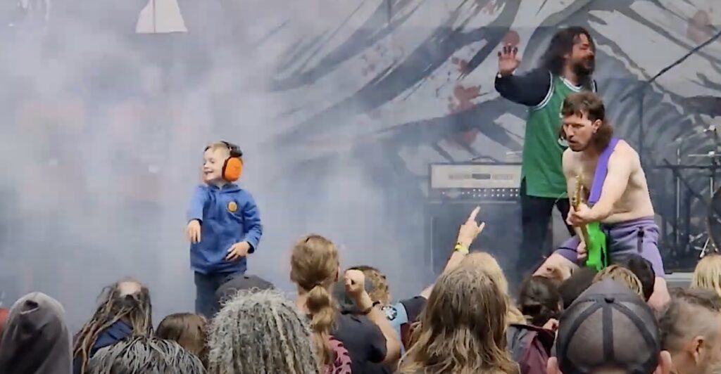 Toddler Takes Over Stage During Death Metal Band's Concert At