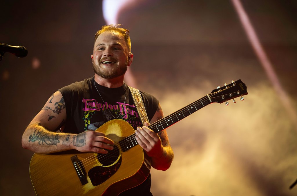 Zach Bryan Plays It Cool As Fans Rush The Stage