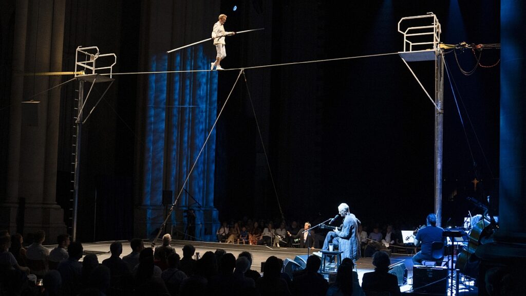 Sting Performs As Philippe Petit Recreates Twin Towers Highwire Stunt: